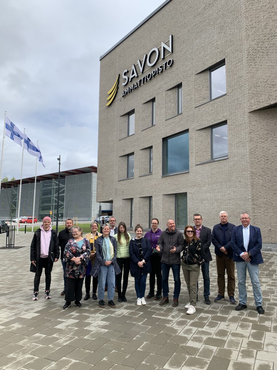 Group of people standing in front of Savo vocational college